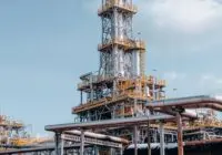 View of a large oil refinery plant with intricate pipelines in Trzebinia, Poland.