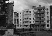 Black and white image of damaged buildings in Bucha, Kyiv Oblast, Ukraine.