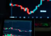 Detailed view of cryptocurrency trading charts on digital screens, showcasing market fluctuations.