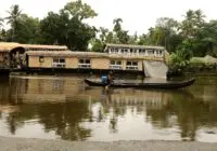 Explore the tranquil backwaters of Alappuzha, Kerala, with traditional houseboats and lush tropical scenery.