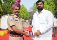 Police officer awarded honorary medal at outdoor ceremony