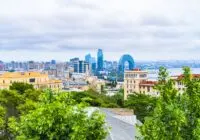 Stunning view of Baku cityscape with modern architecture and lush greenery.
