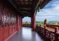 Stunning view of traditional Chinese architecture with intricate wooden designs and a scenic backdrop.